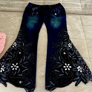 Beautiful one of a kind flare jeans. Like new very stylish. Laced bottom legs.